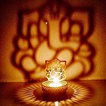 eCraftIndia Shadow Ganesh Ji Metal Tea Light Holder (8 cm x 8 cm x 11 cm, Brown)